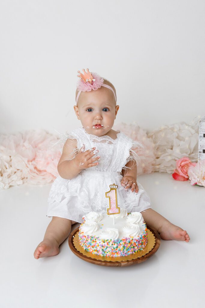 BABY GIRL EATING CAKE