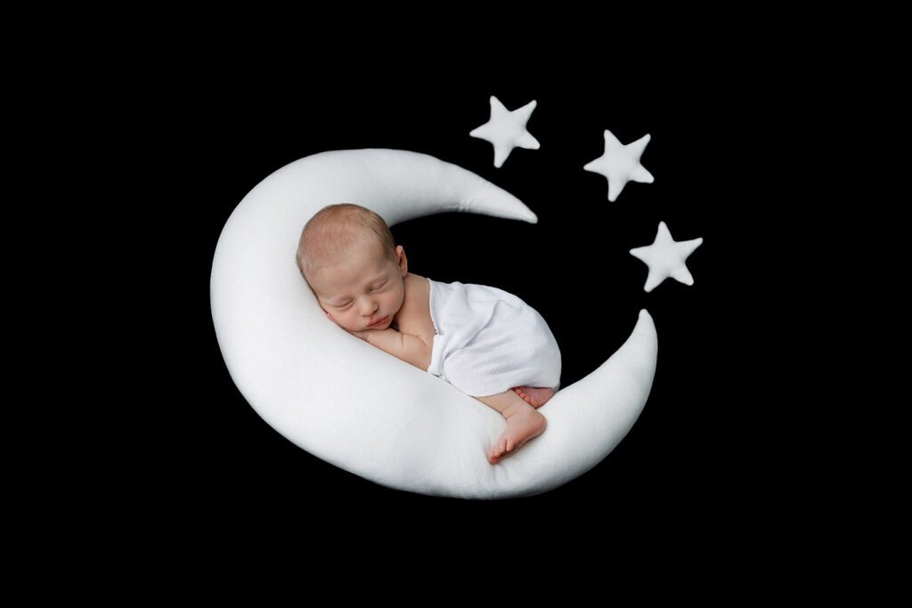 newborn with moon and stars