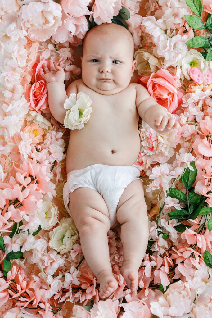 baby in flowers