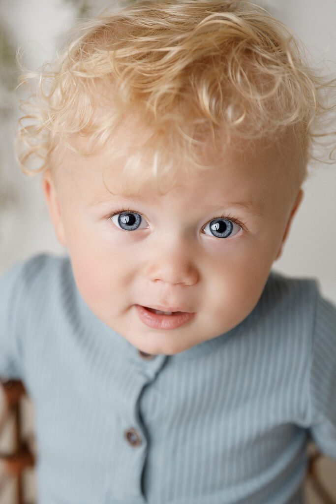 BLUE EYED BABY WITH BLOND CURLS