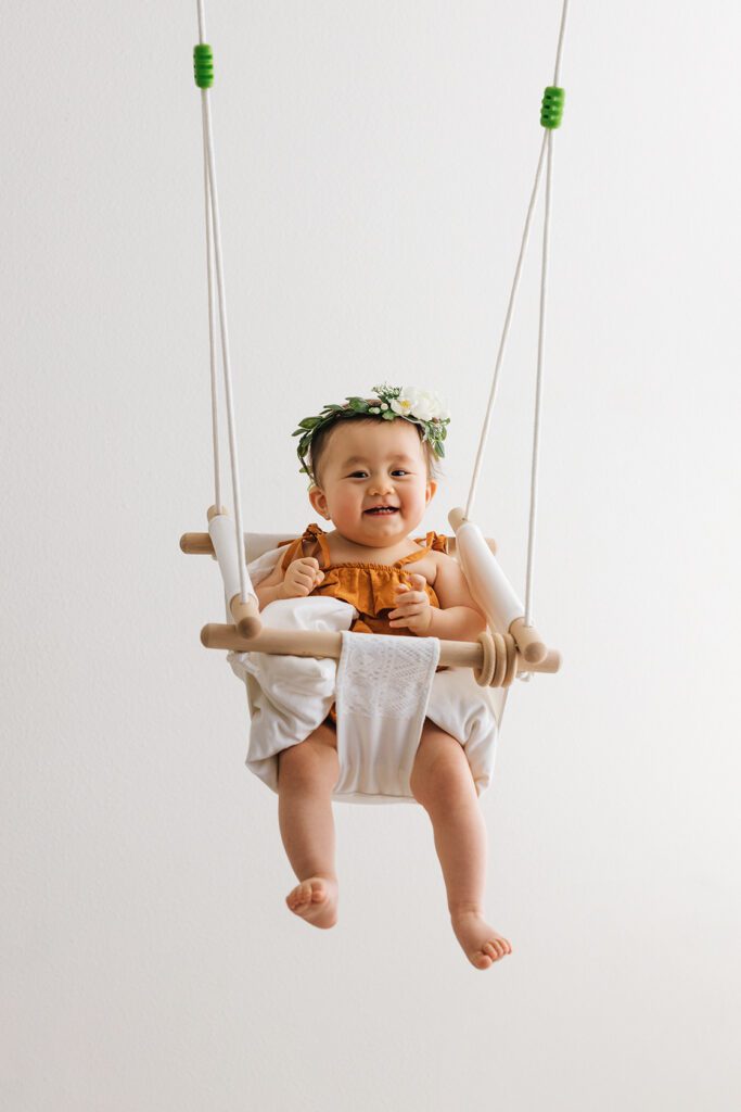 baby girl in swing