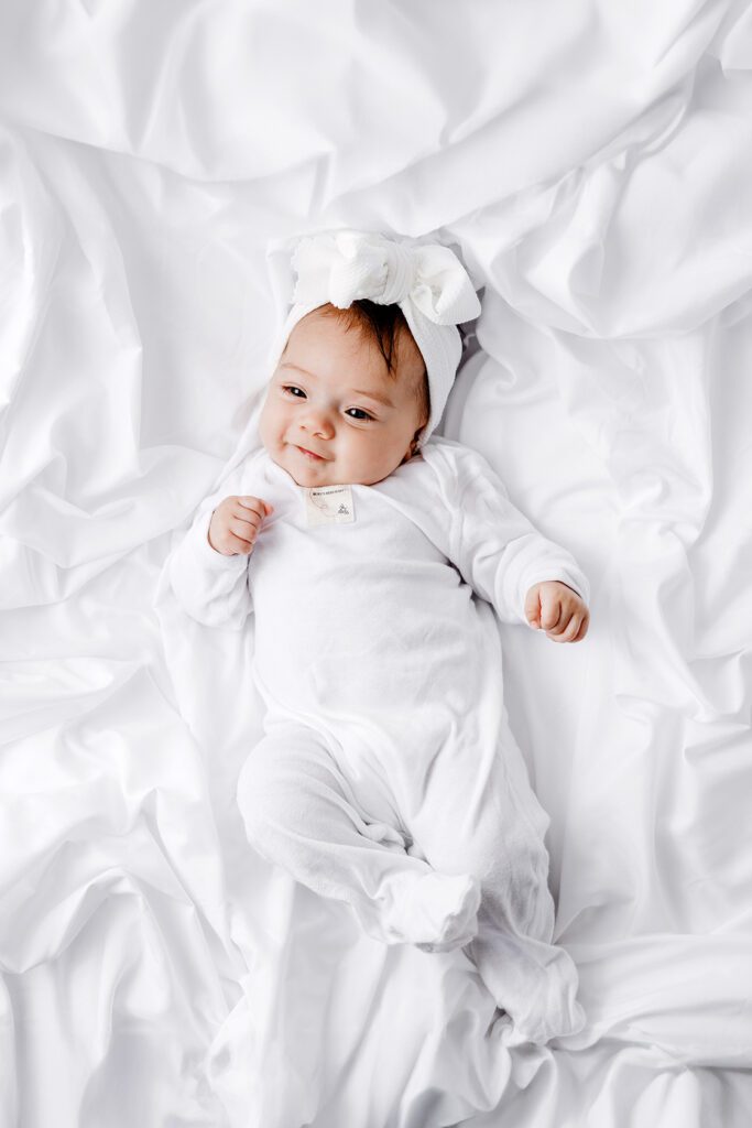 baby girl in white pajamas