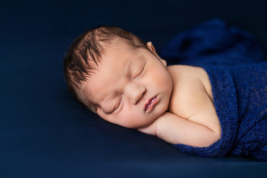 baby boy in blue blanket